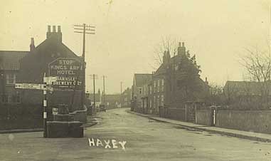 Later postcard of Low Street and the Market Cross